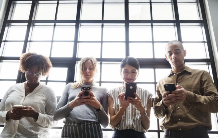 group of people on social media on smartphones